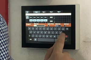 User operating ETC lighting control panel
